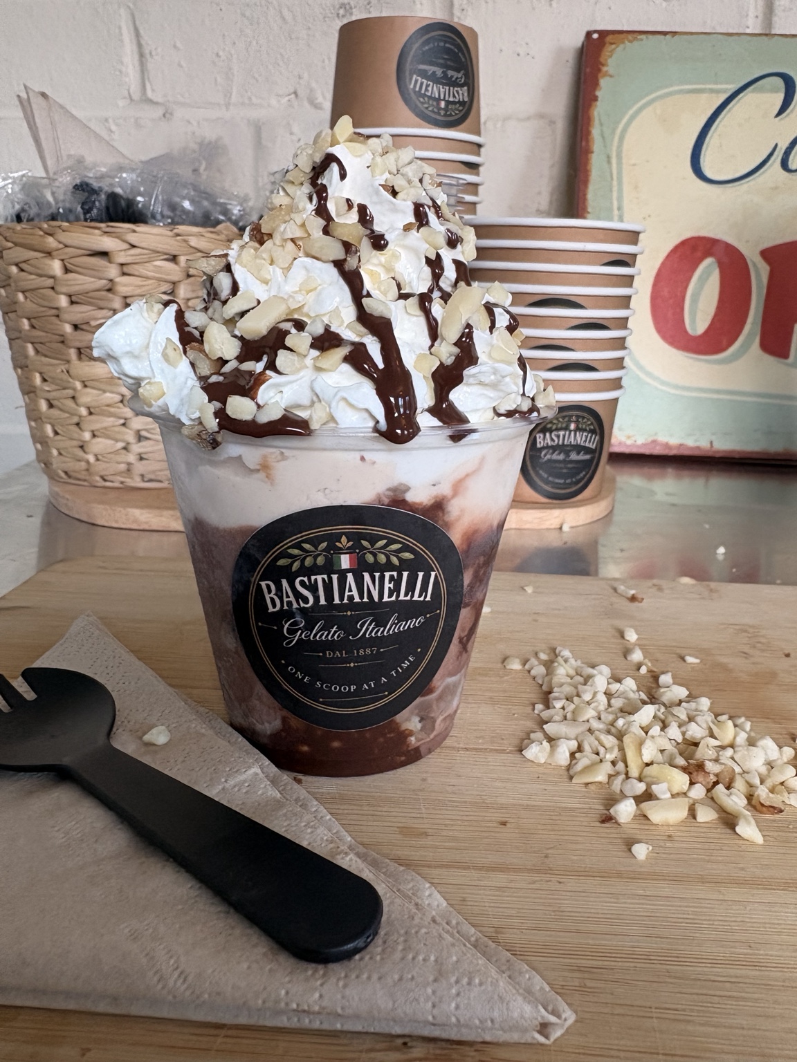 Bastianelli gelato sundae topped with whipped cream and chocolate sauce