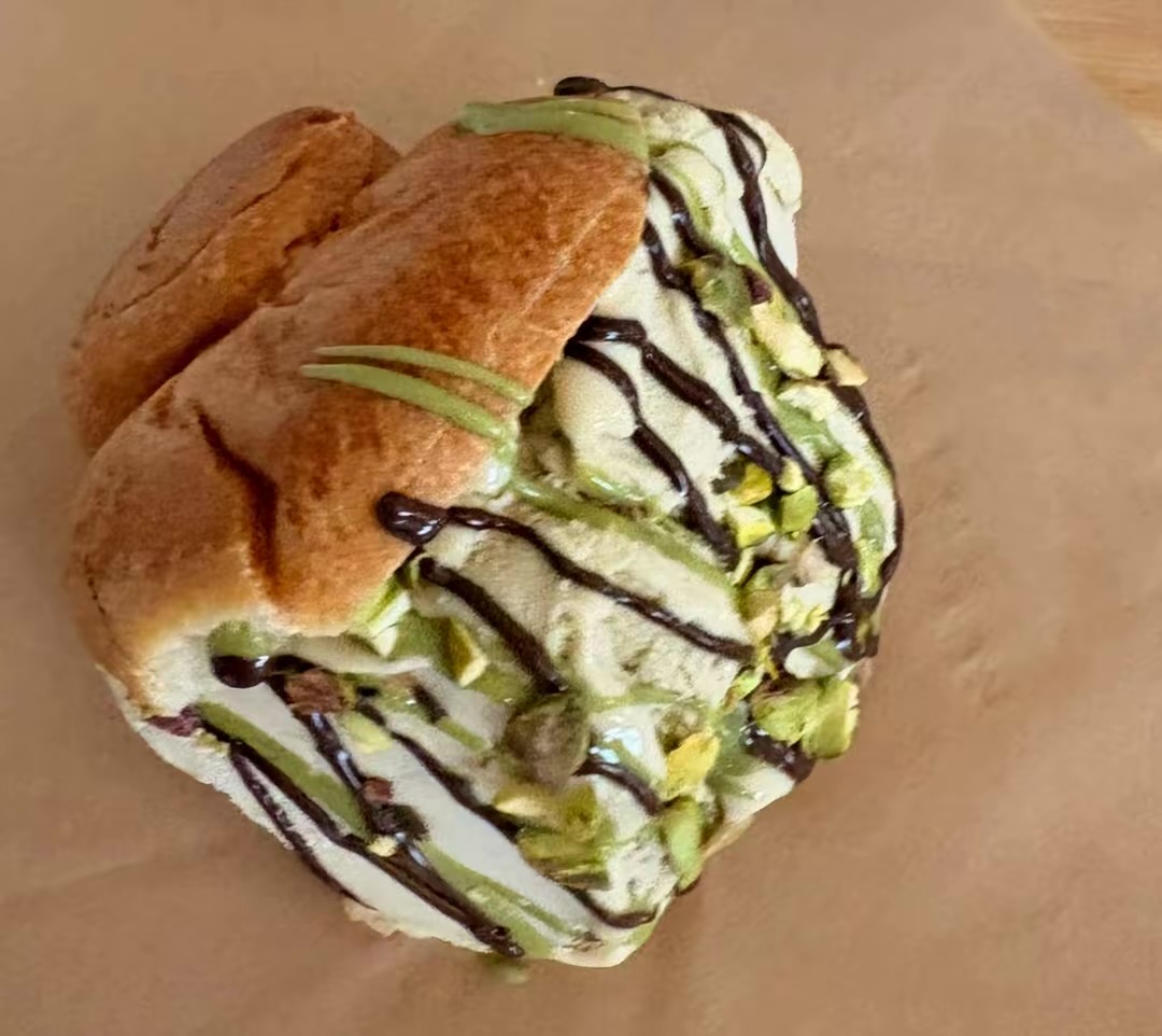 Sicilian brioche bun filled with gelato and finished with pistachio and chocolate
